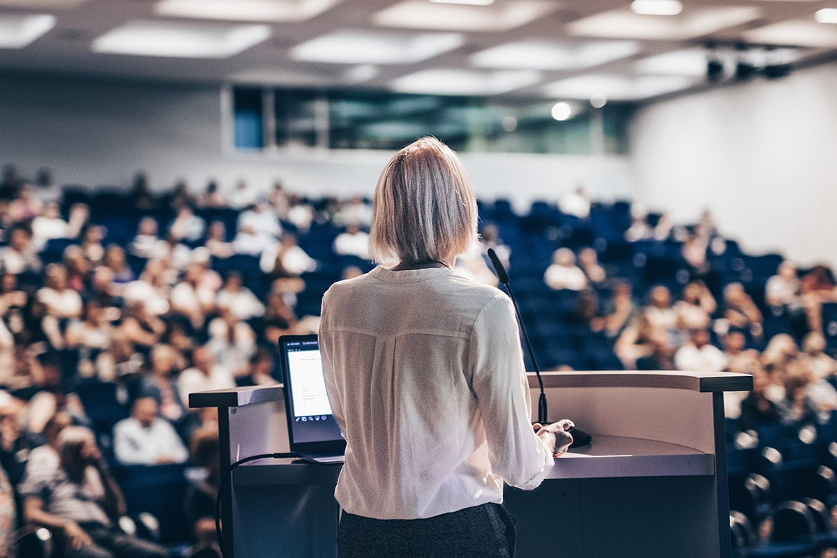 Academic professional speaking at conference