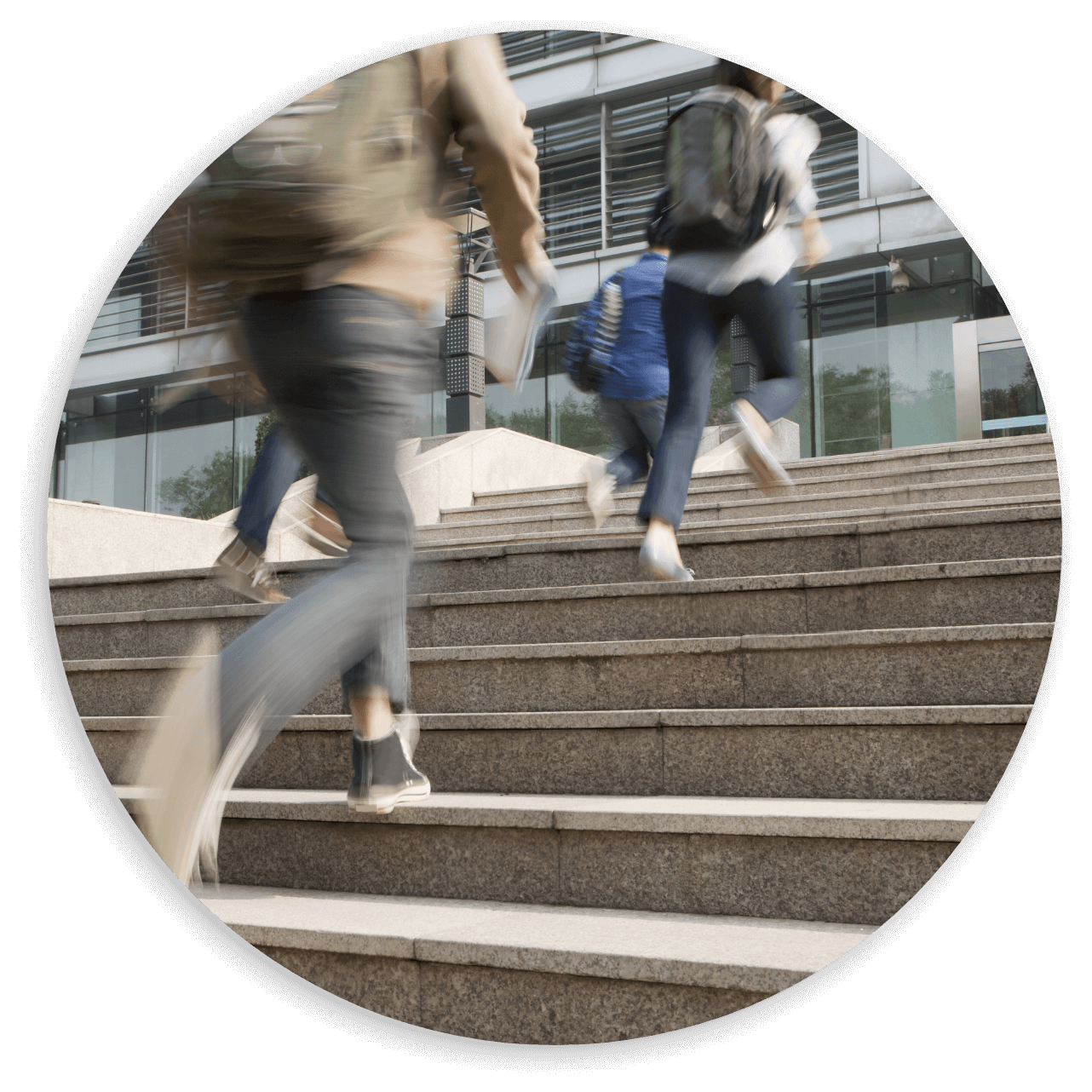 Students running up the stairs with backpack