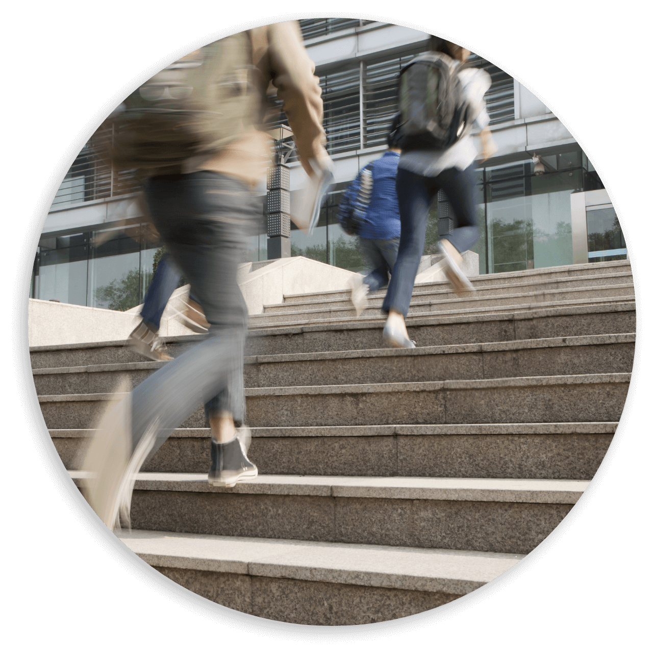 Students running up the stairs with backpack on@2x 2