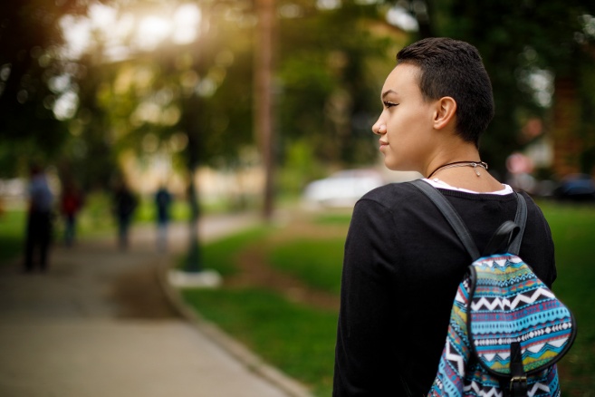 Student looking out on campus