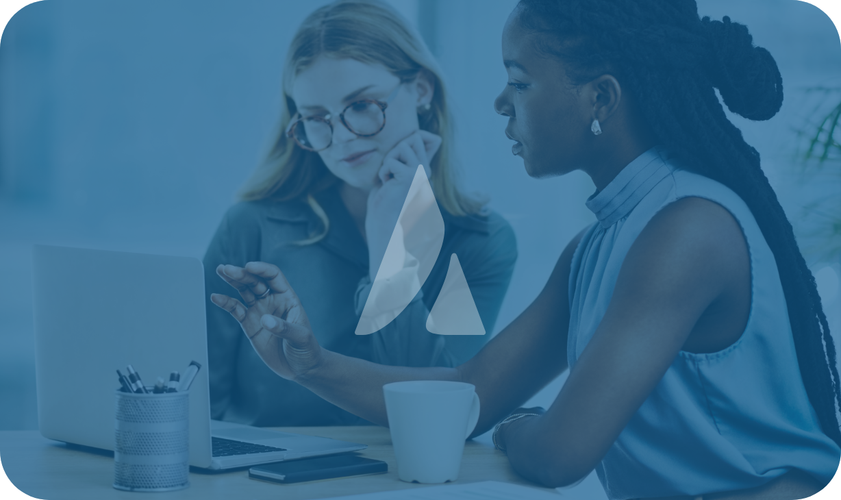 women entrepreneurs talking in front of a computer 