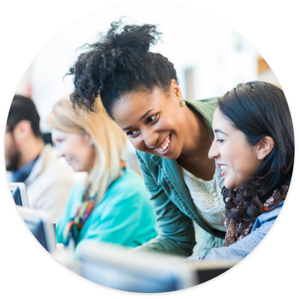 Smiling Teacher helping a student
