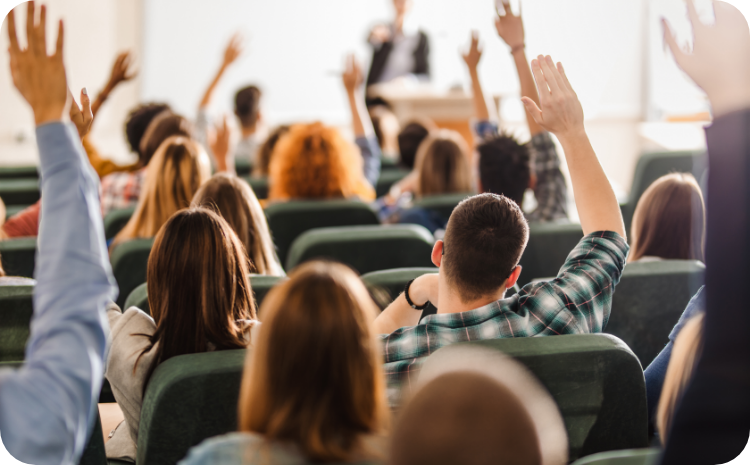 Group of people with Hands raised 