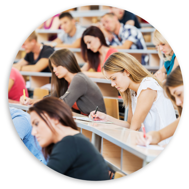 Students taking notes in lecture hall