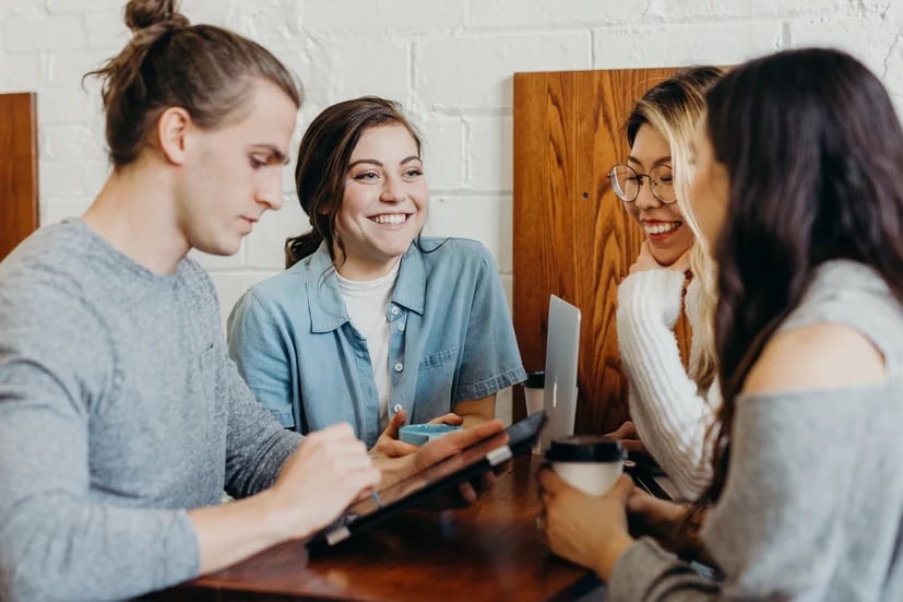Group of young people talking and laughing 